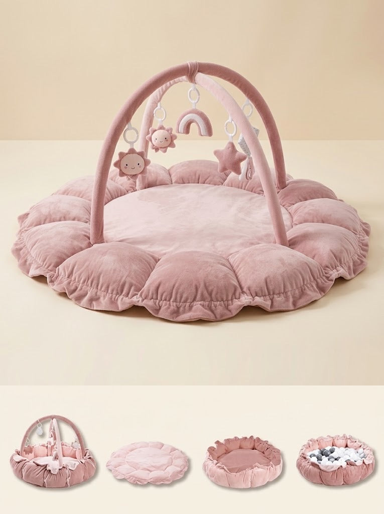 Nid d'éveil Nuage coloris Rose Poudré avec arche, contours en pétales et ses différentes configurations : tapis avec arche, tapis à plat, nid à rebords relevés, piscine à balles